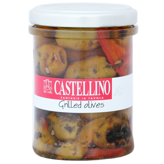 A clear glass jar containing grilled olives, with red and yellow peppers, and Italian spices. The label displays the brand 'Castellino' and the product name 'Grilled Olives'.