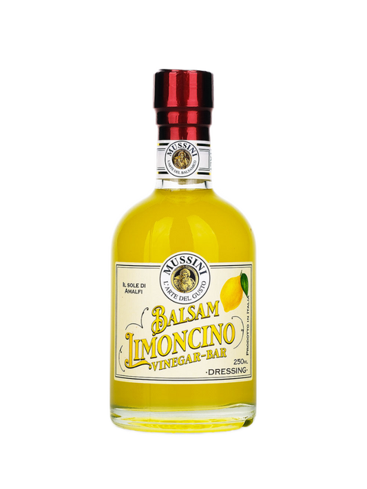 A bottle of Mussini Limoncino Balsamic Vinegar with a yellowish liquid visible through the clear glass. The label indicates it is a 250ml bottle and features the brand name and product title.
