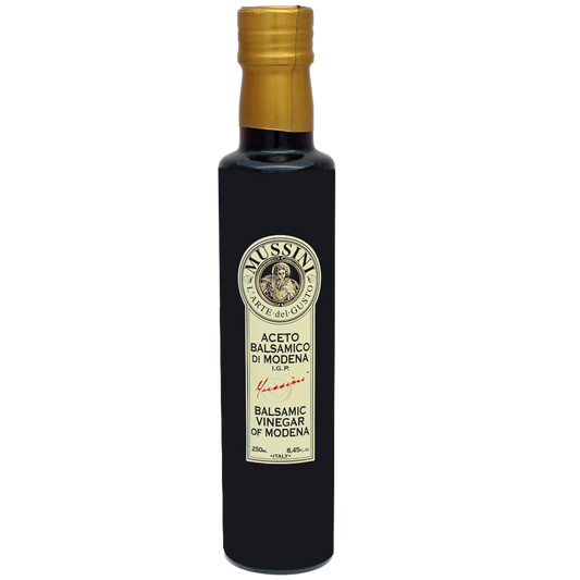 A bottle of Mussini Balsamic Vinegar with a label indicating it is a 2 year aged product, 8.5oz (250ml).