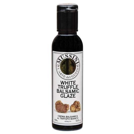 Bottle of Mussini White Truffle Balsamic Glaze with the label showing the product name and an image of truffles.