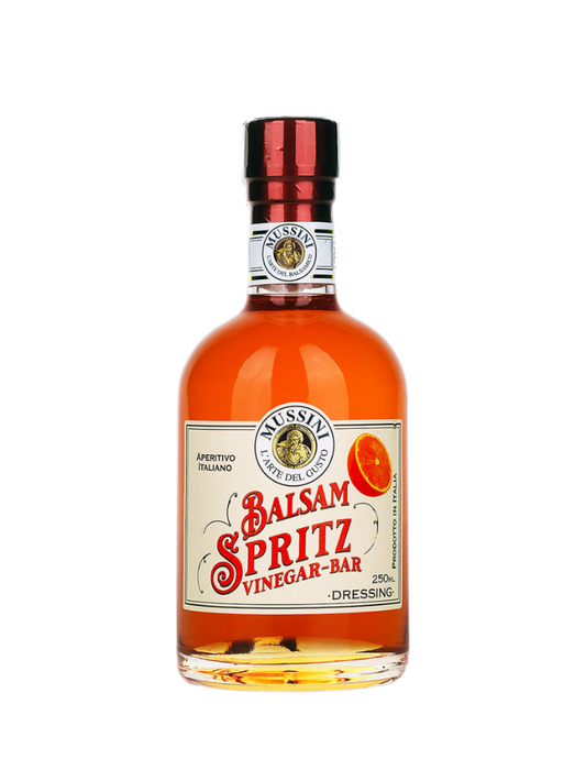 A bottle of Mussini Balsamic Spritz Vinegar Cocktail Mixer, with a label showing the product name and volume.