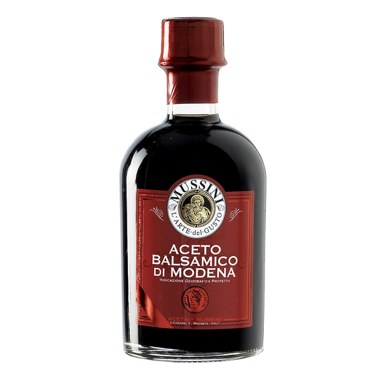 A bottle of Mussini Balsamic Vinegar branded as '1 Coin (3 Year) I.G.